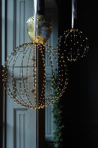 Light up spheres in a window by Graham and Greene