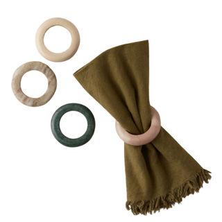 Napkin rings with a green napkin in center