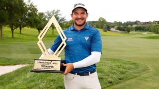 Alejandro Tosti with the Pinnacle Bank Championship trophy