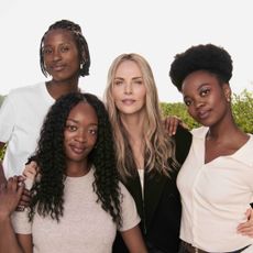 Charlize Theron and recipients of her scholarship