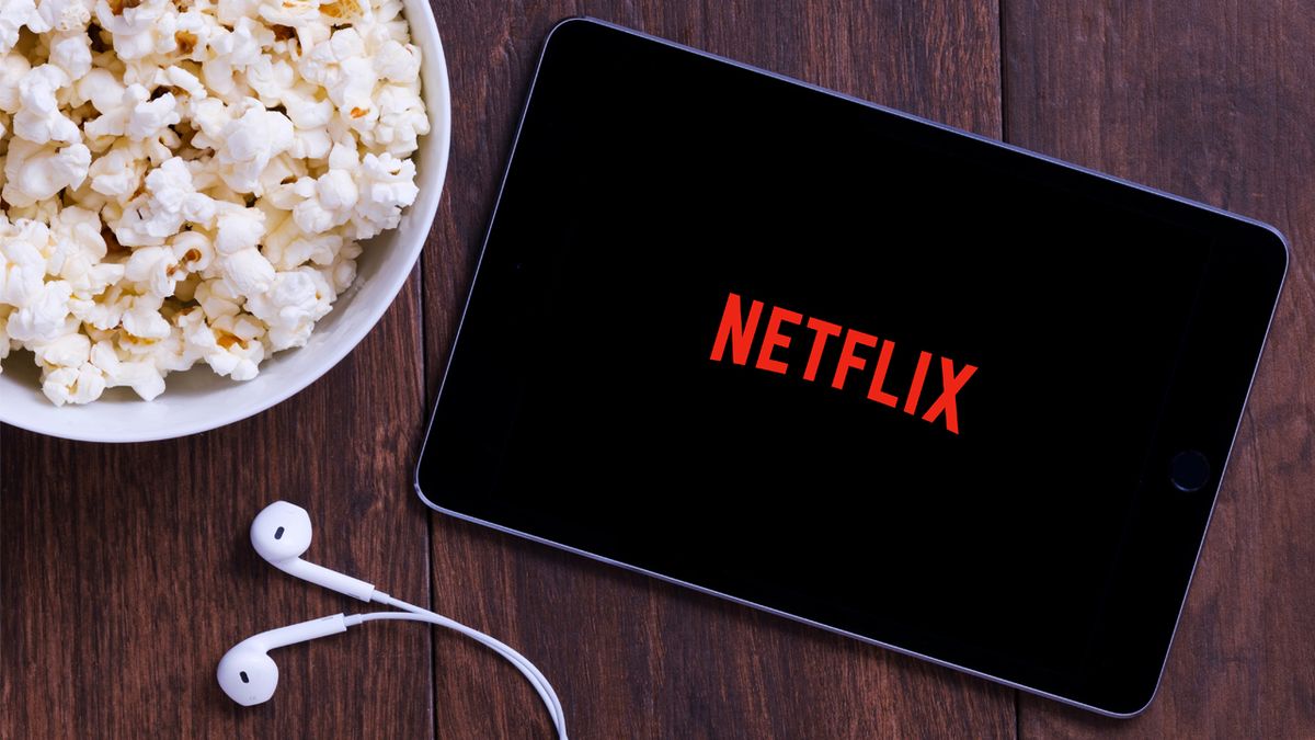 Netflix in a tablet next to some popcorn