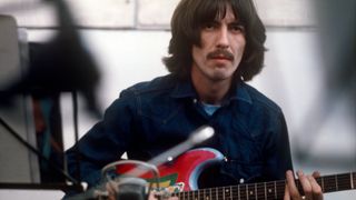George Harrison pictured with his 'Rocky' Fender Stratocaster