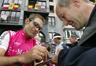 Santiago Botero signs an autograph at the 2004 Tour de France, and he's signed his 2003 Team Telekom Pinarello Pista track bike that's available to buy on eBay, too