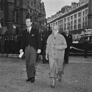 Prince Philip wears a suit as he attends the memorial service for Edwina Mountbatten at Westminster Abbey in London alongside his mother Princess Alice of Battenberg, who is wearing a long overcoat and nun's habit on March 7, 1960