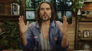 Russell Brand appearing on his podcast