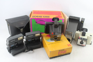 A selection of vintage cameras against a white background