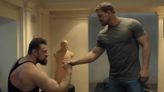 Olivier Richters and Alan Ritchson arm wrestling on Reacher