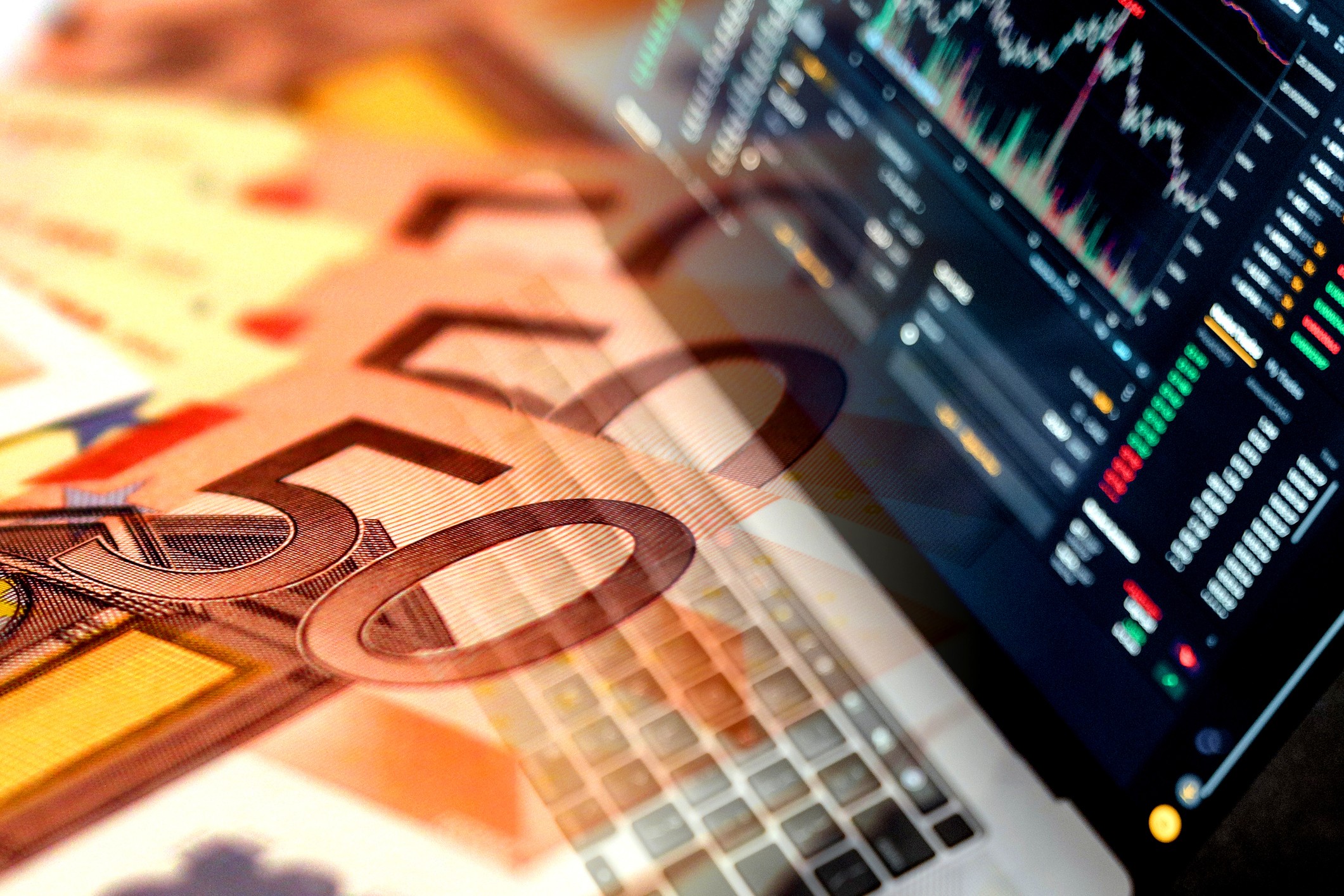 euro bills and notebook with stock market indicators