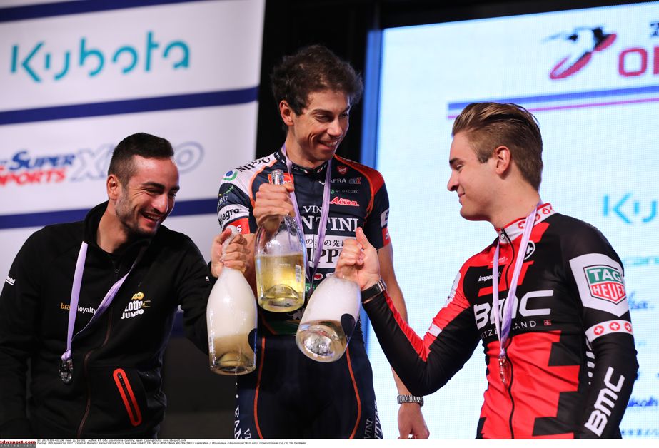 Marco Canola, Juanjo Lobato, and Bram Welten with the bubbly on the podium