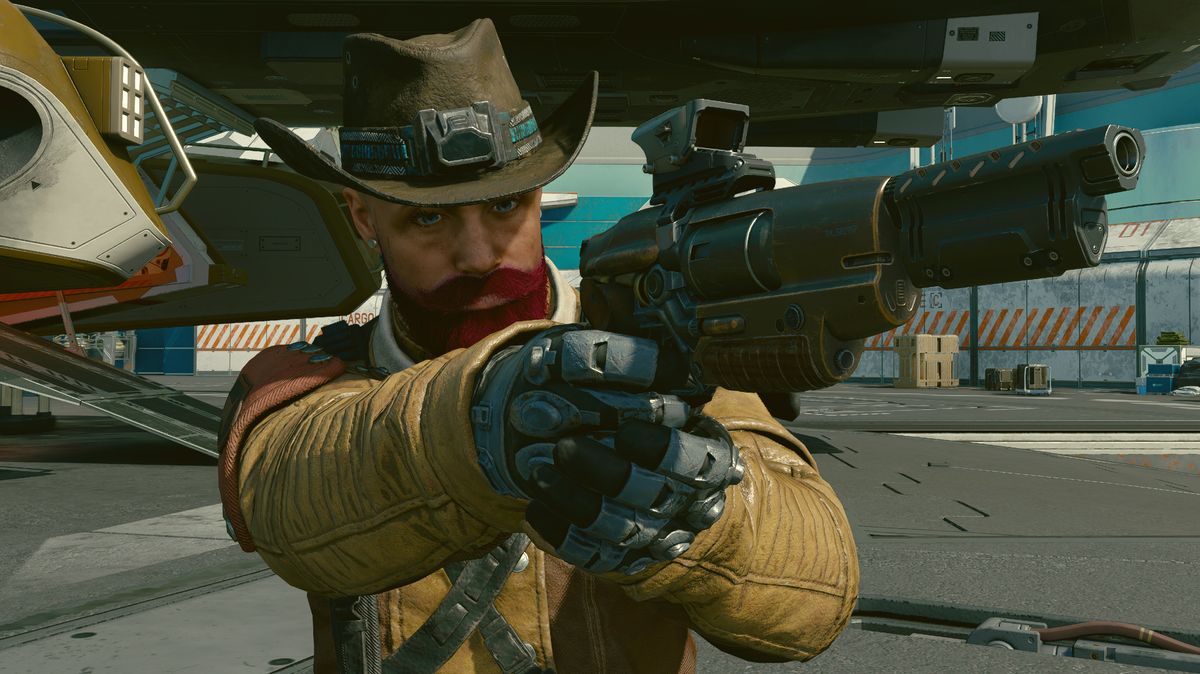 A futuristic cowboy pointing a gun