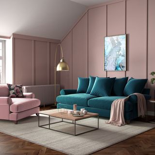 green and pink sofas in pink living room