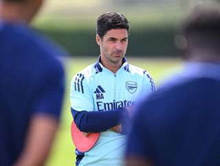 Arsenal boss Mikel Arteta at the Gunners training ground watching on