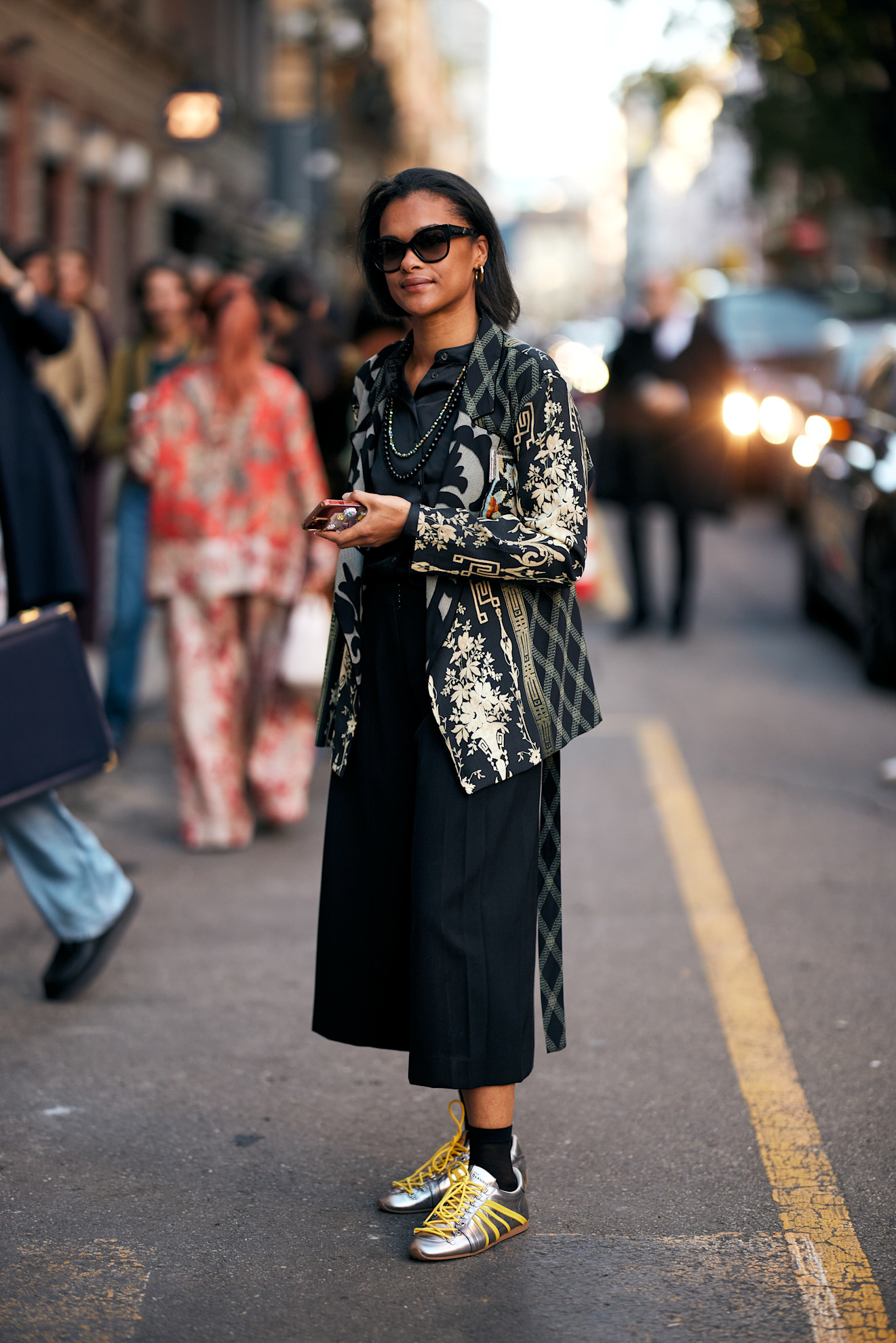 woman wearing silver sneakers in Milan