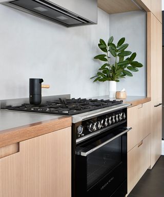 A self-cleaning, freestanding range cooker in a modern kitchen