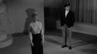 Marsha standing in department store as mannequin in The Twilight Zone