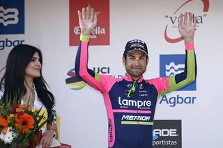 Davide Cimolai (LampreMerida) waves at the crowd from the stage 6 podium