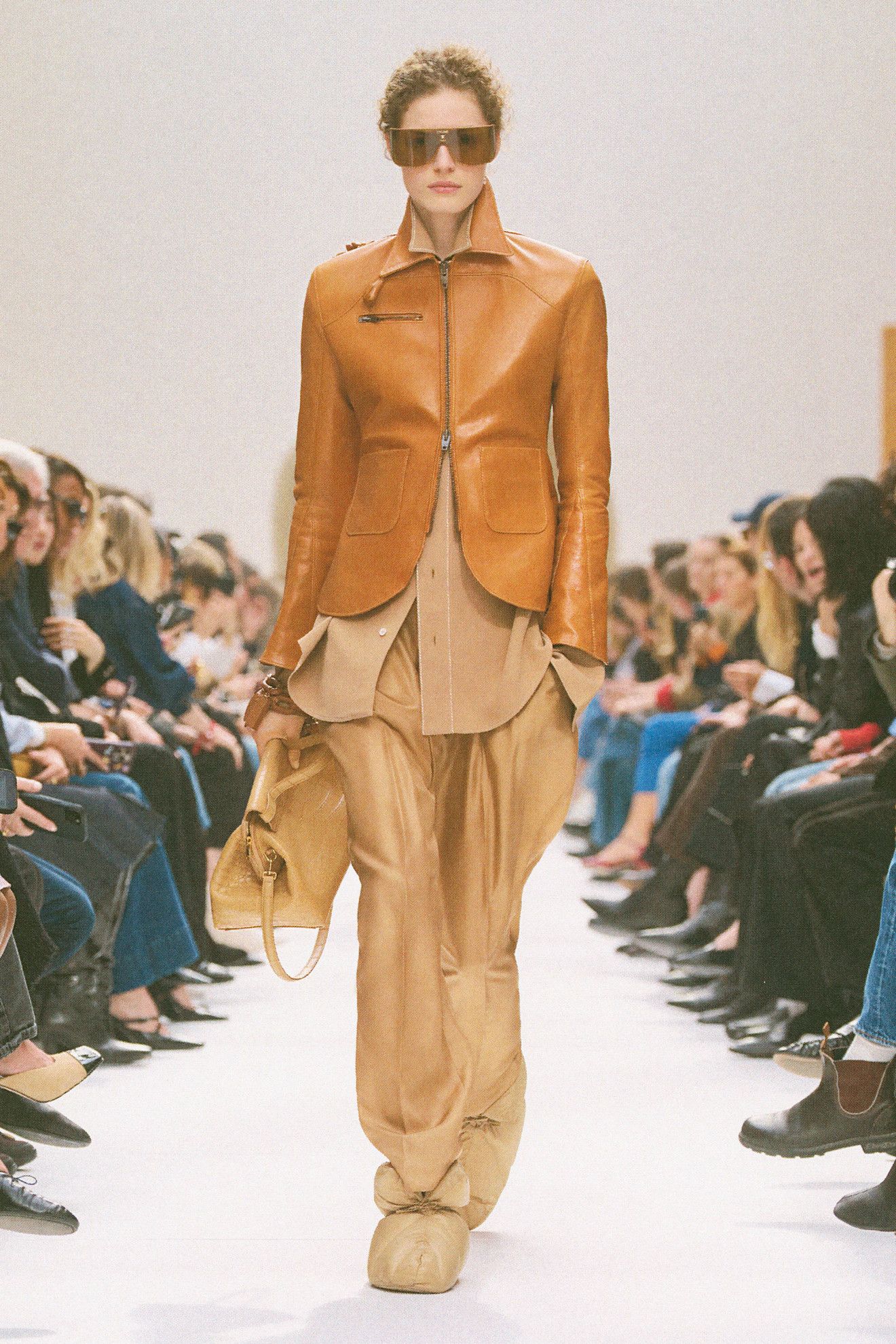 a model walks the celine f/w 26 runway.