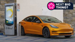 A Tesla car being recharged at a Shell Recharge station