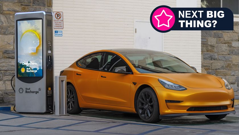 A Tesla car being recharged at a Shell Recharge station