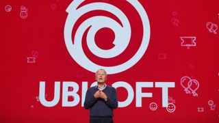 Yves Guillemot in front of a Ubisoft logo.