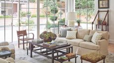 Living room with large windows and vintage furniture
