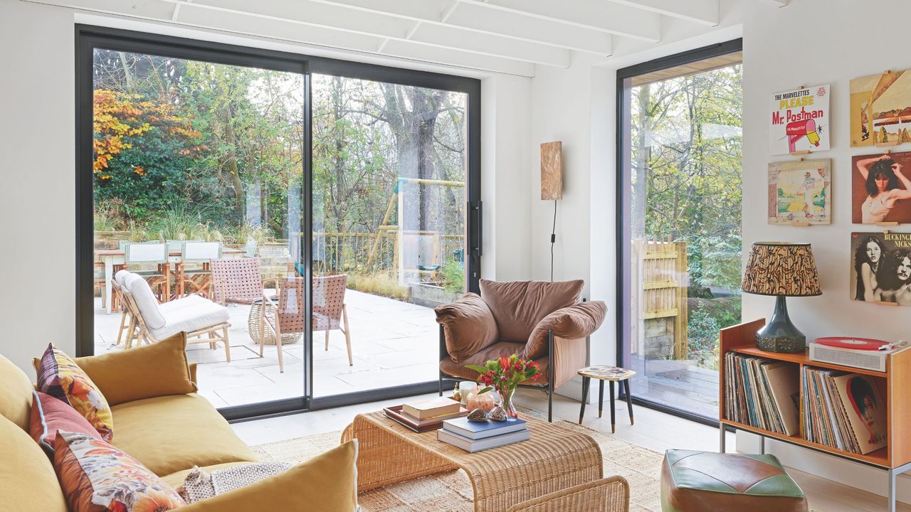 Sliding doors and a fixed window off living room, with slim frames to maximise views of the garden