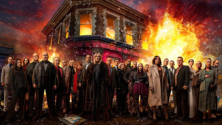 The cast of EastEnders in front of the exploding Queen Vic