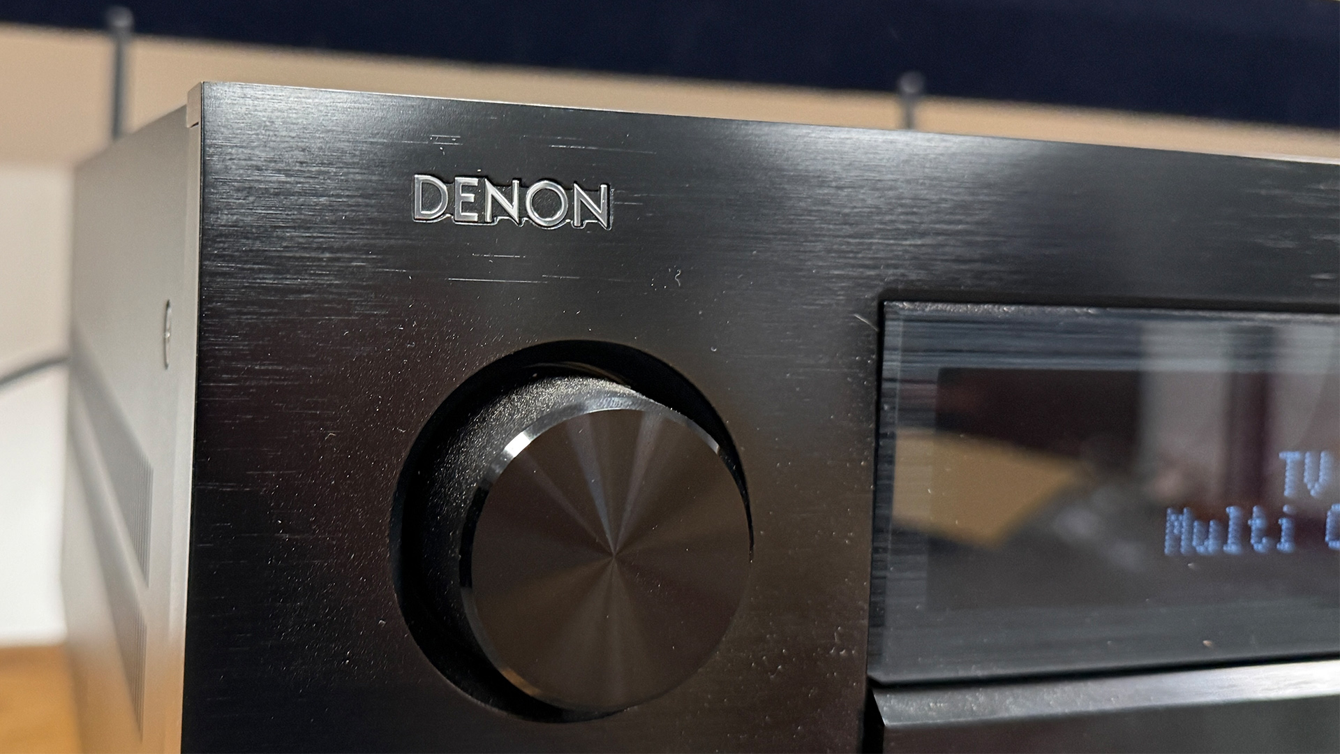 Denon AVC-A1H AV amplifier close up on control dial