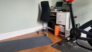 Fit&Well fitness writer Harry Bullmore unrolled his yoga mat next to his working from home set-up to stretch during the work day