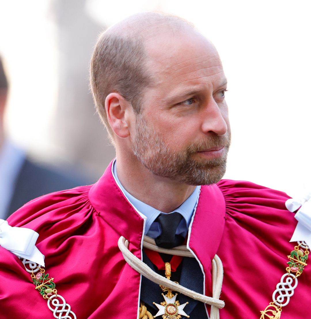 Prince William wearing a red robe 