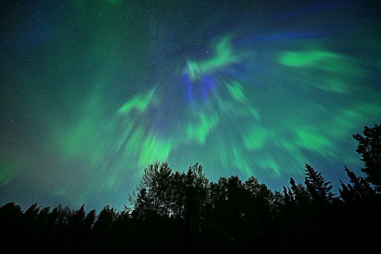 Aurora outburst above Fox Creek, Alberta, Canada captured by photographer and stormchaser Jo Majko.