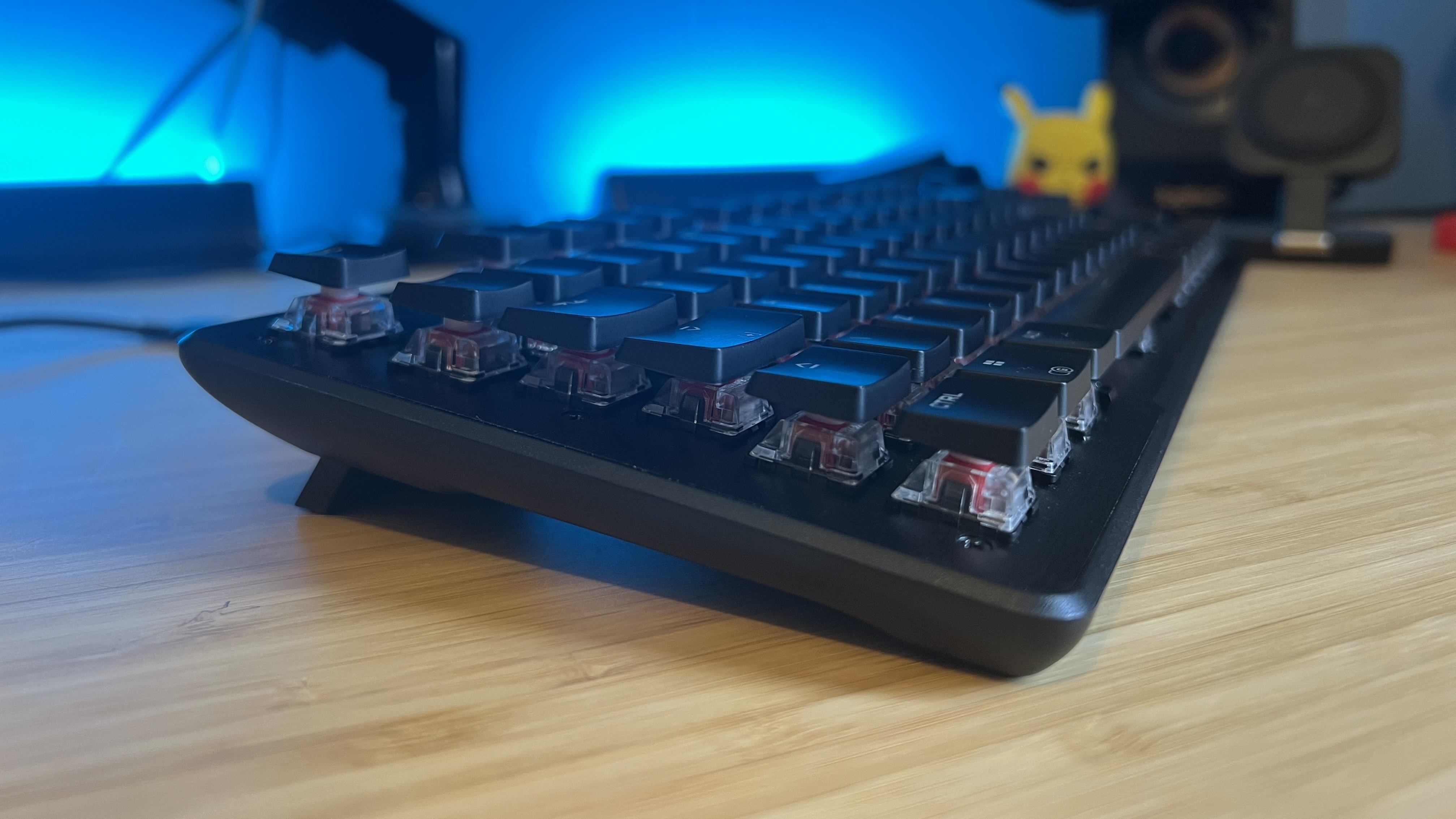 Side view of Turtle Beach Vulcan II TKL gaming keyboard on a wooden desk