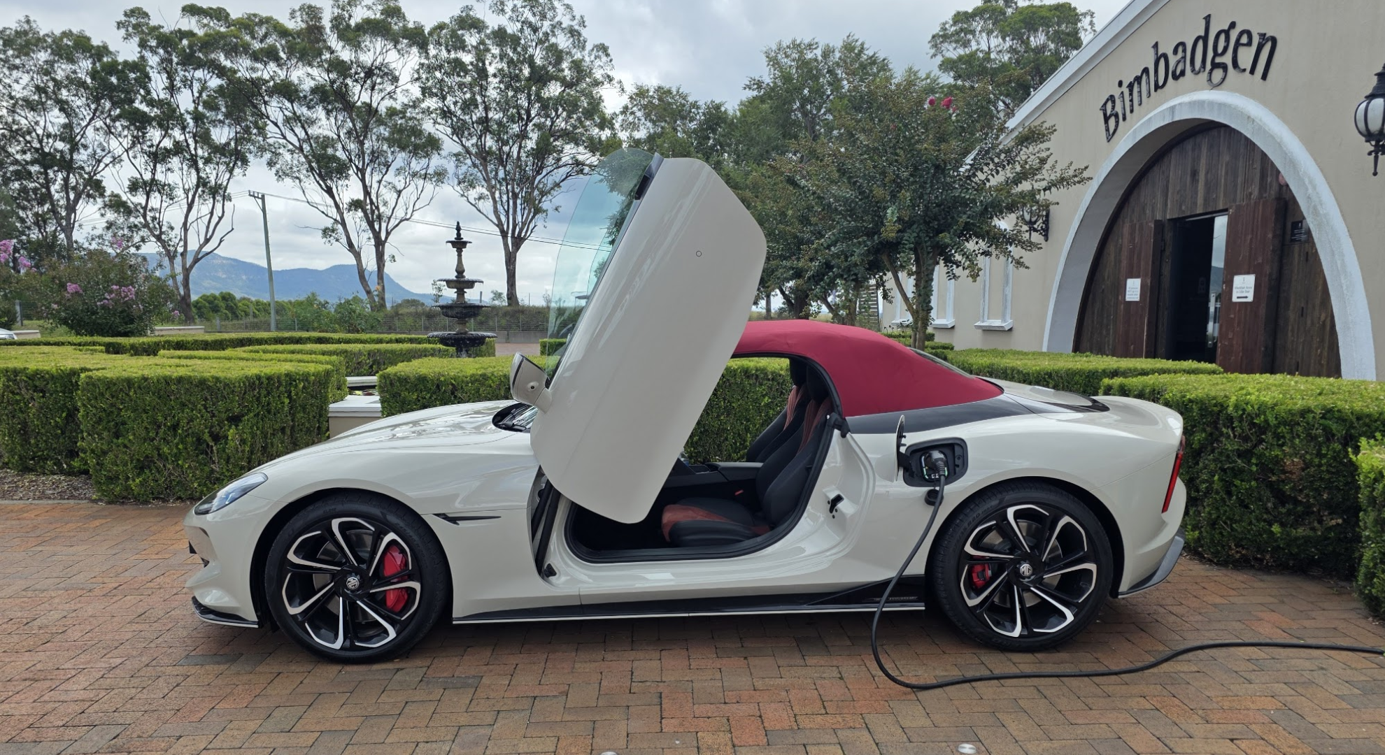 The MG Cyberster parked and charging in public