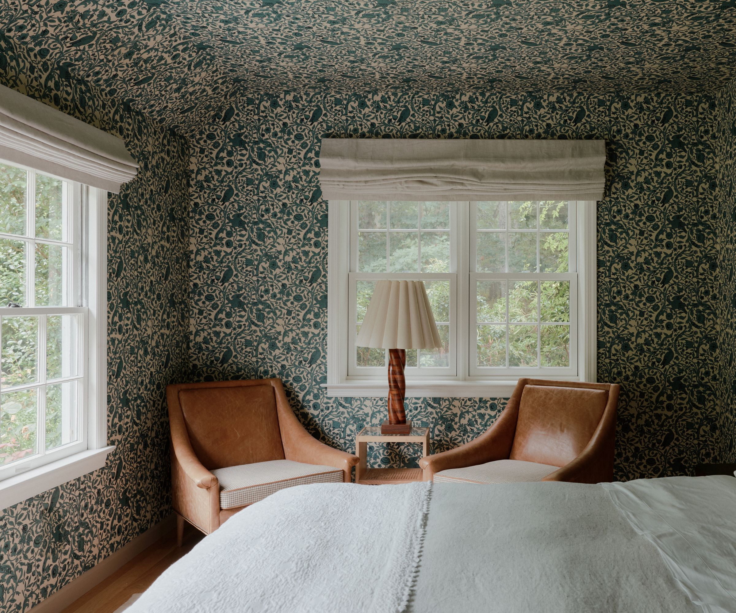 bedroom with floral wallpaper on ceiling