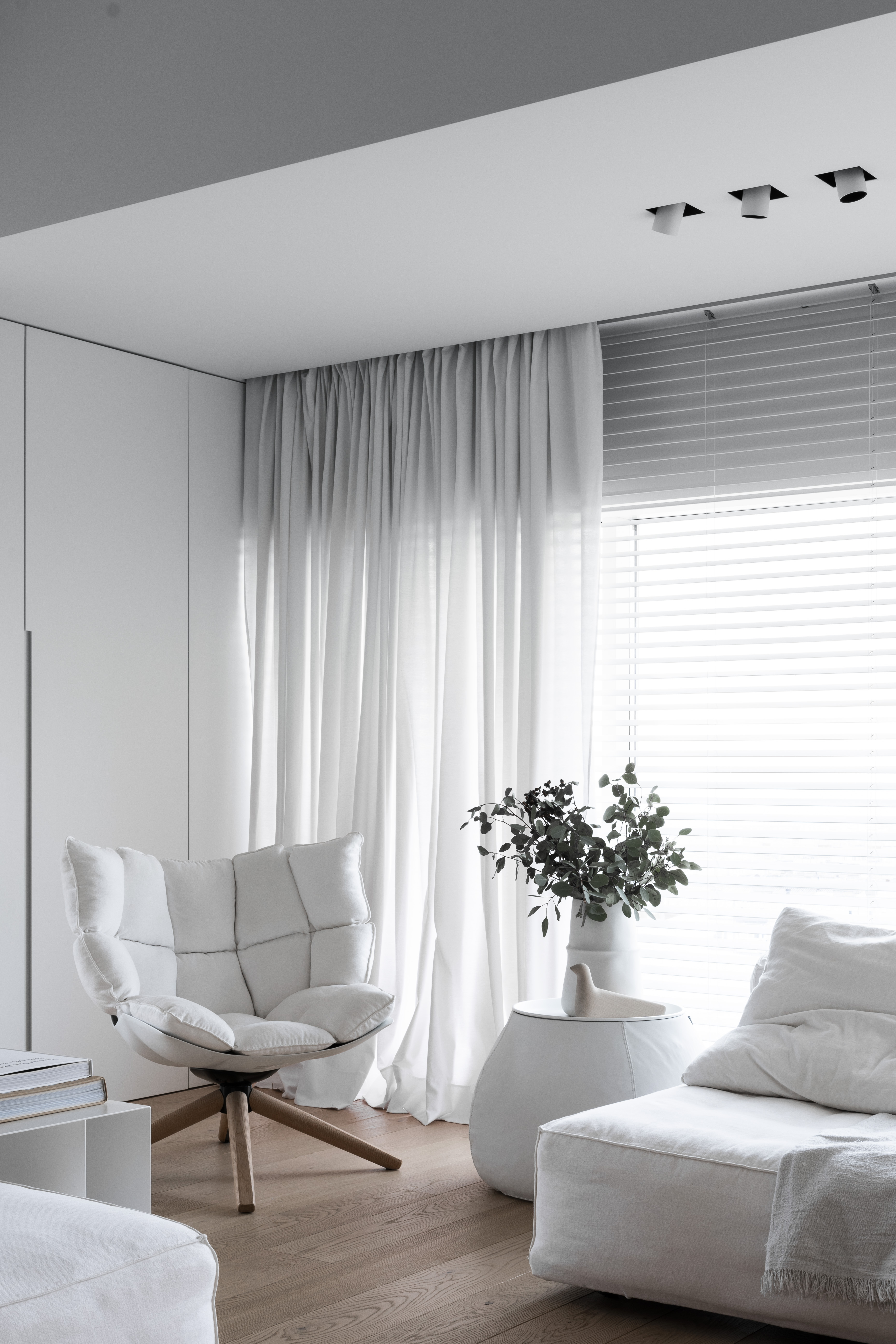 Cool interior design with a vase on a table and chairs