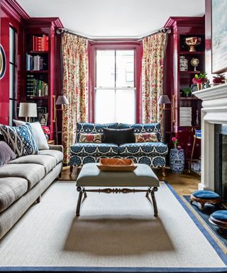 Crimson living room with coffee table and large rug