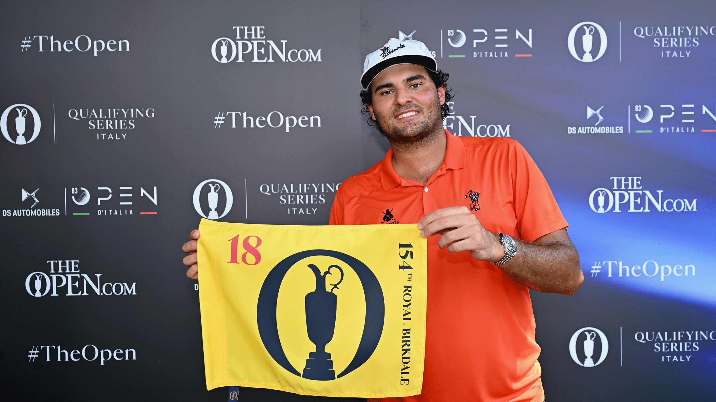 Eugenio Chacarra poses with an Open pin flag after earning his place at the 2026 Italian Open
