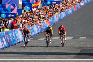 Picture by Alex Whitehead/SWpix.com - 04/08/2024 - Paris 2024 Olympic Games - Cycling Road - Trocadero-Trocadero (158.0km) - Paris, France - Womenâ€™s Road Race - Marianne Vos (Netherlands) sprints to second place with Lotte Kopecky (Belgium) finishing third and Blanka Vas (Hungary) in fourth