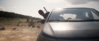 Deadpool and Wolverine drive Nicepool's car.