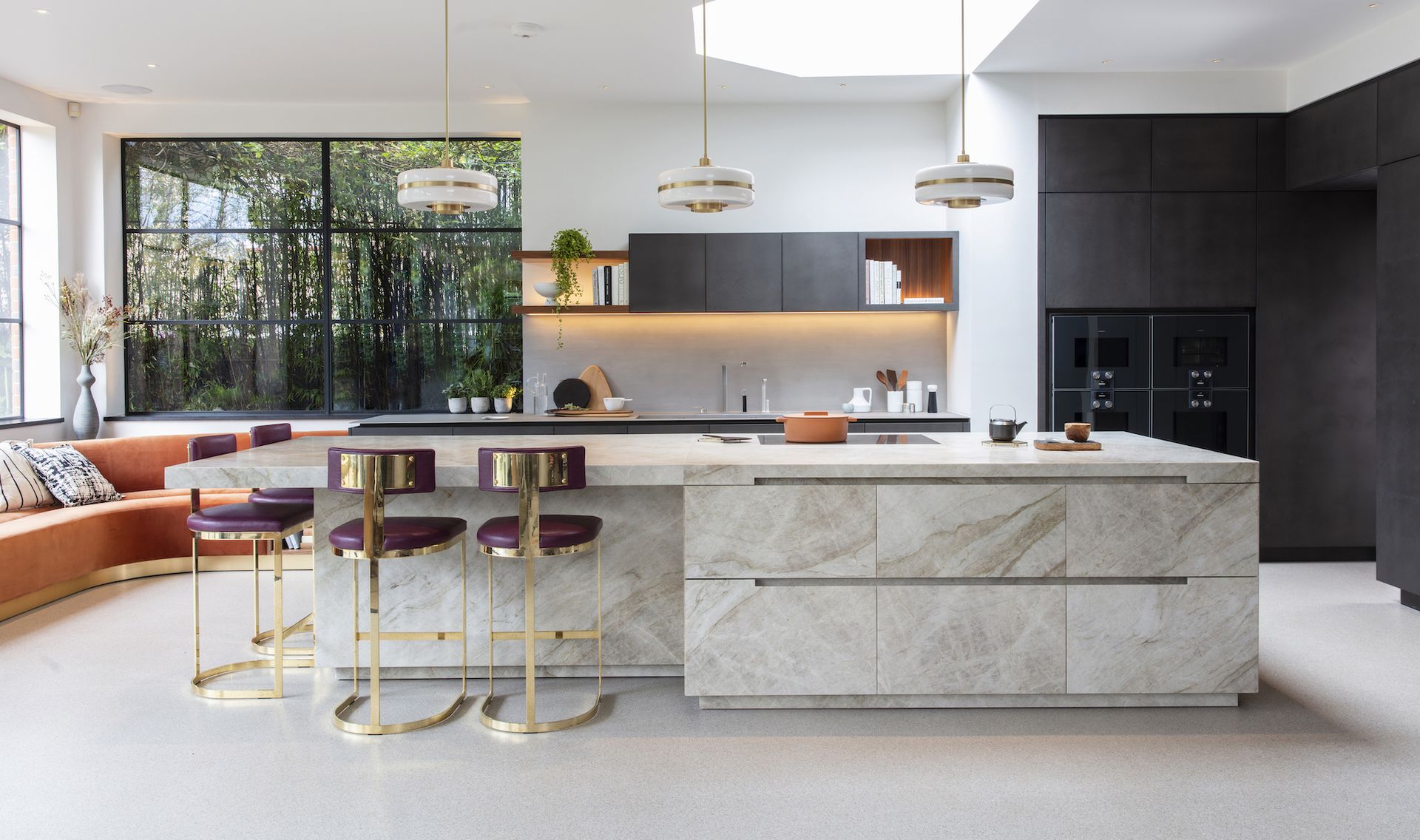 modern kitchen with touches of metallics, gold and white pendants