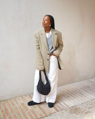 London based influencer Taffymsipa in white jeans and beige blazer