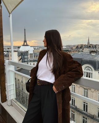 Fashion influencer @livvperez wearing an on-trend winter outfit in Paris.