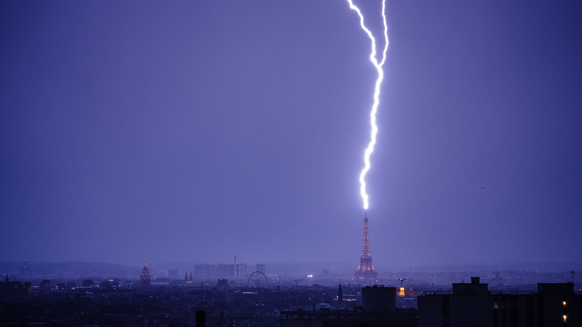 Lightning strikes the Eiffel Tower during a thunderstorm in Paris, France