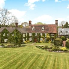 house exterior with lawn area