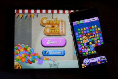 A person plays "Candy Crush."
