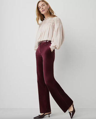 a model wearing a pair of velvet pants also worn by Katie Holmes