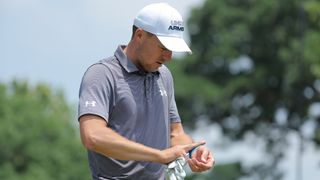 Jordan Spieth checks on his injured wrist during the 2023 Charles Schwab Challenge