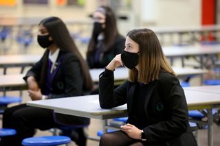 Students wearing masks in school, as five term school year is considered