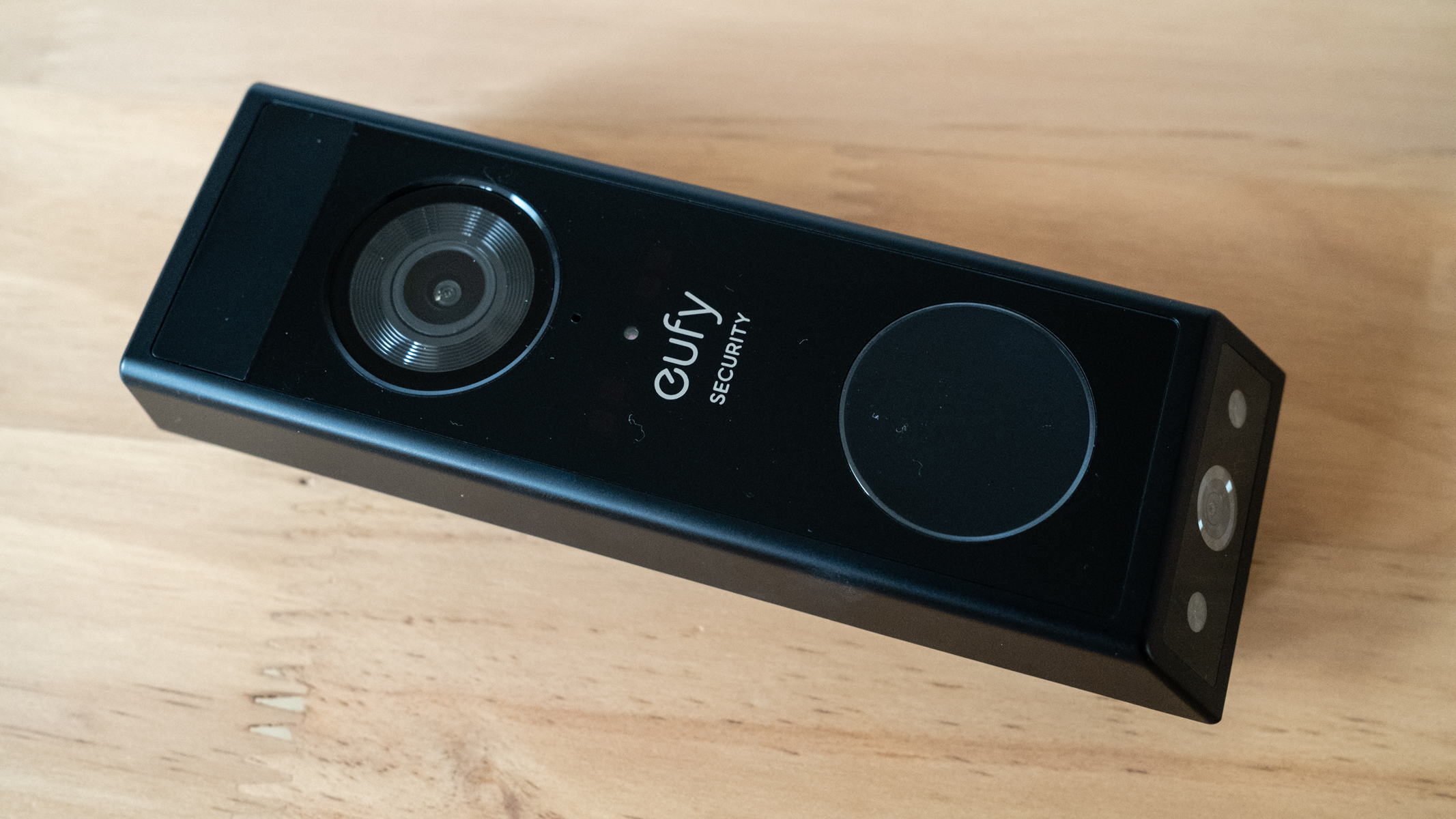 Eufy Video Doorbell E340 on a wooden table