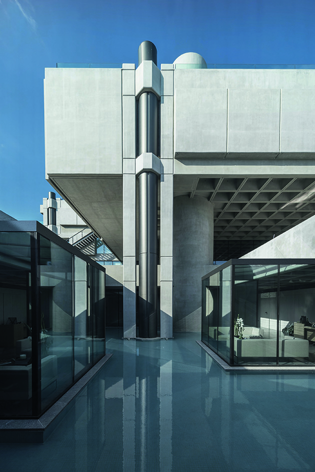 Greek brutalist gem AGET Iraklis by Alexandros Tombazis redesigned by Georges Batzios, clean concrete and marble and stone surfaces and shapes